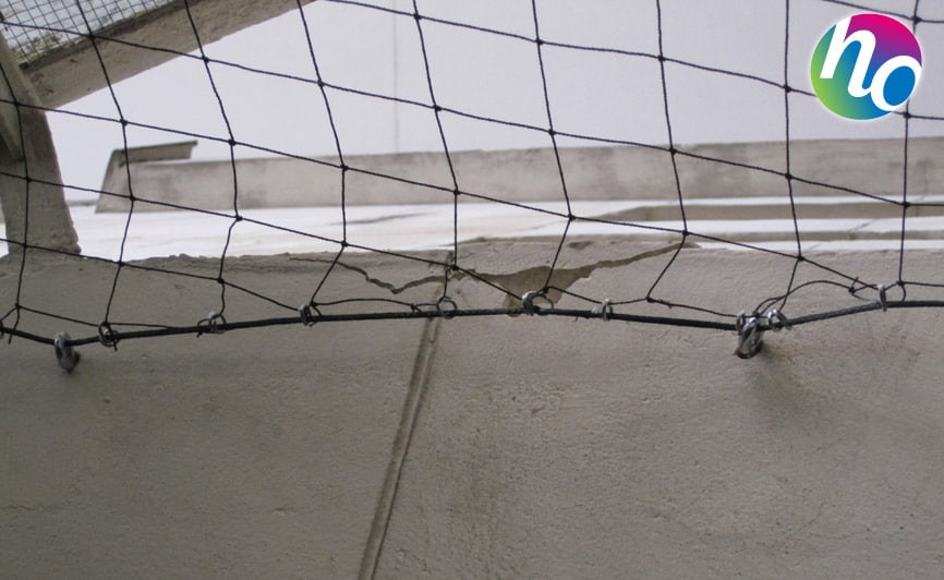 Pose de filet anti-pigeon amovible pour balcon ou terrasse à Valence 26  dans la Drôme - General Hygiène